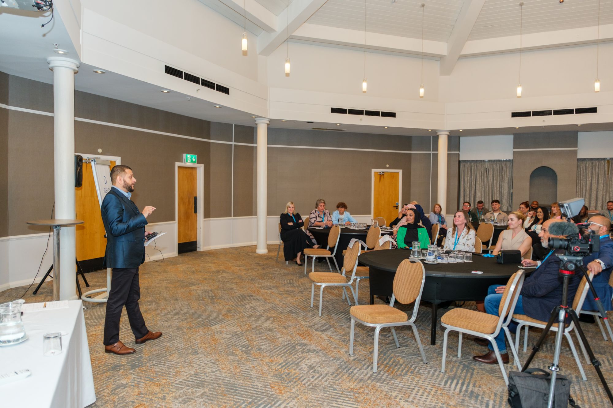 Faisal speaking to a room of business owners at a Progressive Business Network event